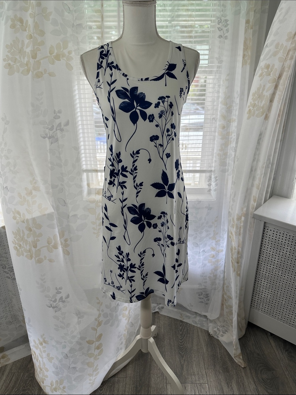 Sleeveless White Dress with Navy Floral Print